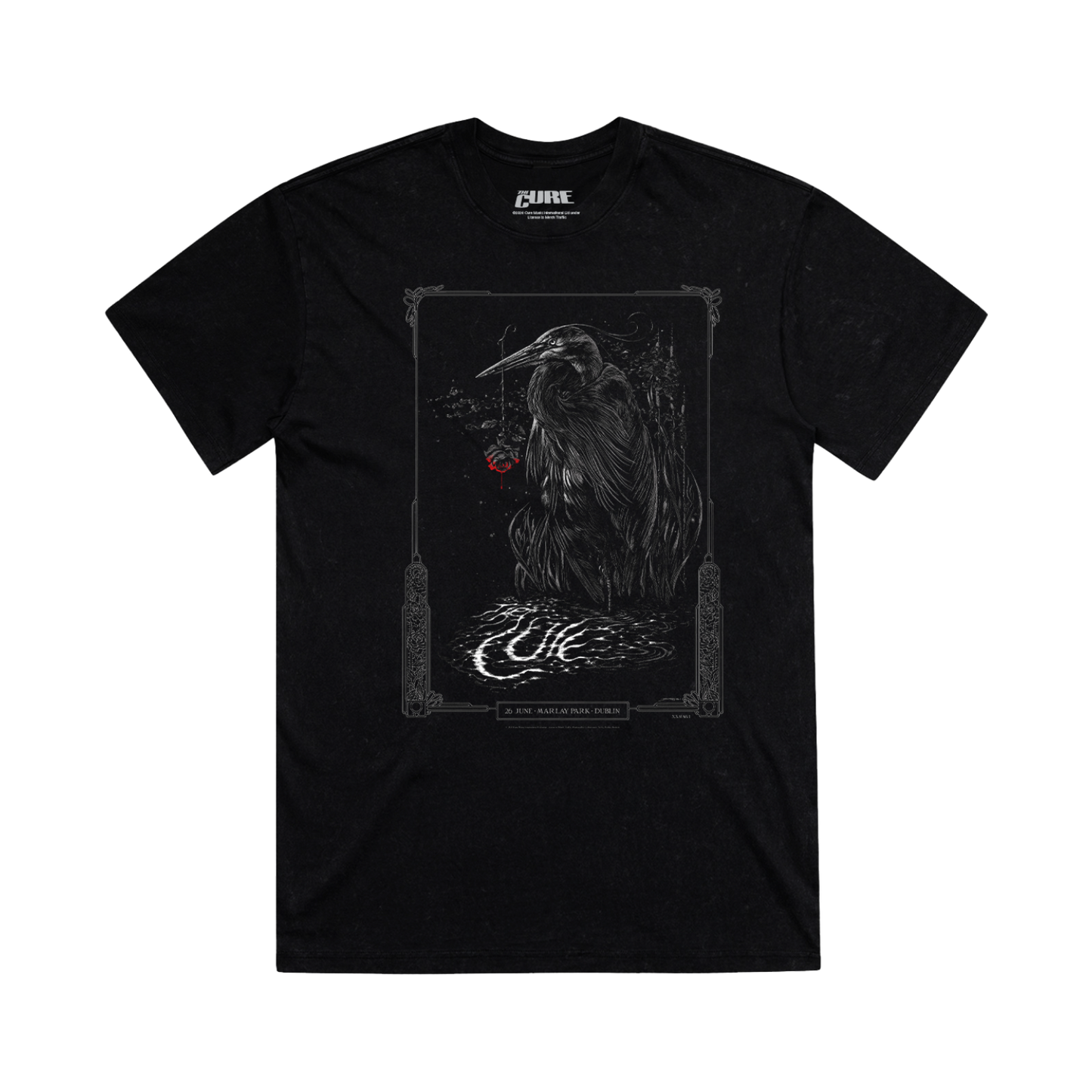 Black t-shirt with a graphic design of a black and white heron with decorative elements and event details for The Cure's performance at Marlay Park in Dublin, Ireland on June 26, 2026.