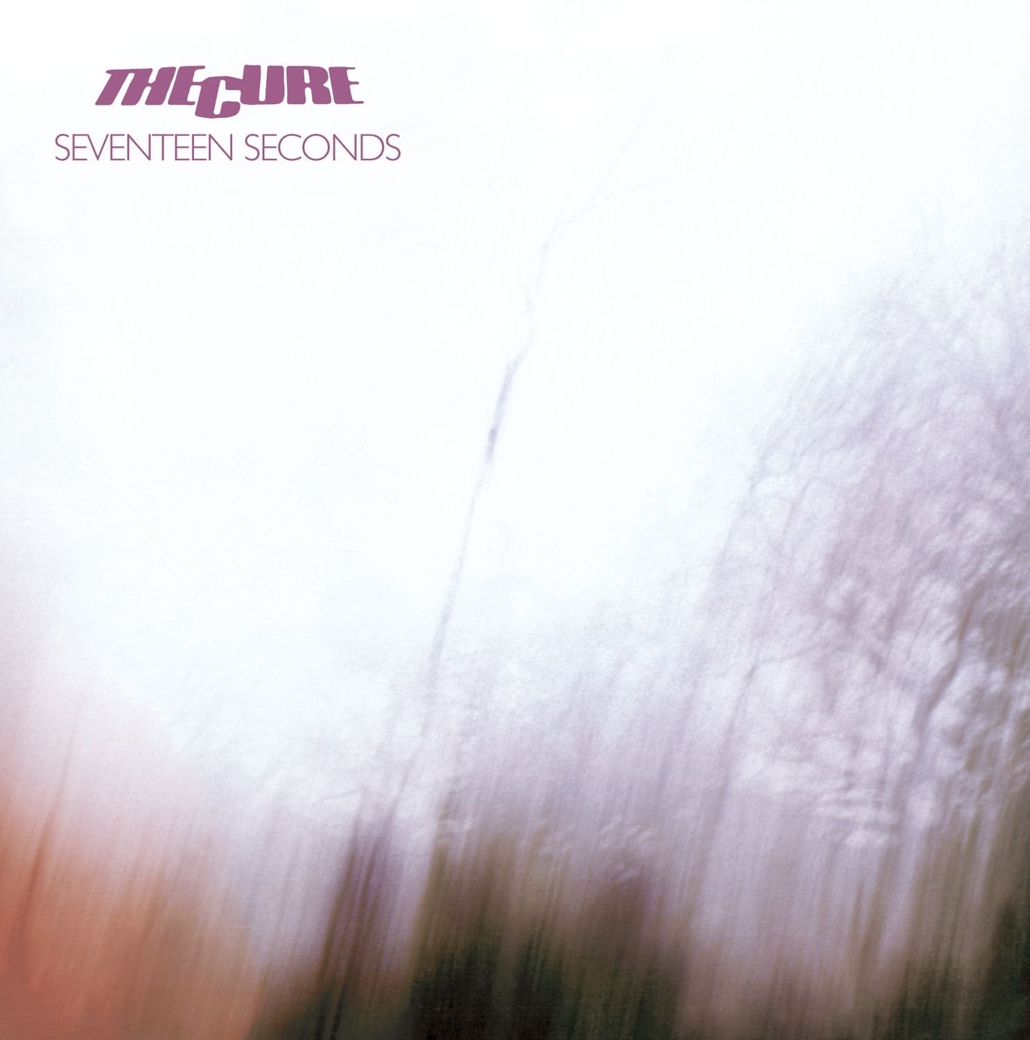 Album cover for 'Seventeen Seconds' by The Cure with blurred abstract design.
